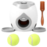 Dog interactive ball launcher in grey with tennis balls and treat scoop.