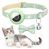 A front-facing view of a checkered cat collar featuring a built-in silicone AirTag holder, a decorative bowknot, and a safety breakaway buckle.
