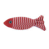 Red fish-shaped toy with white zigzag pattern on a white background