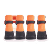 A set of heavy-duty antifreeze winter dog snow boots showcasing water-resistant upper fabric, adjustable security straps, and a rugged black non-slip rubber sole designed for large dog paw protection on ice.
