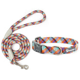 A high-density matching pet walking gear set showing a vibrant orange, purple, and teal geometric braided climbing rope leash alongside an adjustable matching collar with a grey quick-release buckle.