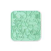 A green textured anti-choking silicone licking mat for dogs and cats with multiple suction cups for secure placement.