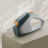 A sage forest green 5m automatic retractable dog and cat traction rope featuring a durable non-toxic ABS plastic housing.