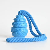 An interactive grenade-shaped arctic sky blue rubber dog food leaking educational toy displaying its texturized bumped bite-resistant ridges and hollow treat-dispensing interior core.