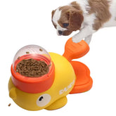 A sunny duckling yellow interactive duck pet feeder puzzle toy showing its front press paddle handle, anti-slip base, and 3 interchangeable transparent kibble lids.