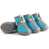A set of durable all-weather winter dog shoes featuring thick thermal plush interior insulation, breathable upper fabrics, and a rugged black non-slip rubber grip sole for paw protection.