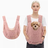 Pink quilted pet chest carrier vest worn on the front, designed to hold small dogs or cats securely during outdoor travel.