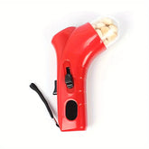 A red handheld pill dispenser or capsule shooter with a clear cap containing beige capsules, shown on a plain white background with a black wrist strap.