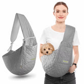 A sophisticated grey safety adjustable pet sling carrier displaying its soft padded shoulder strap and secure hands-free travel layout for small dogs.