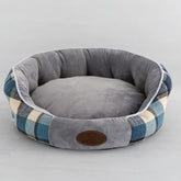 Arctic Sky Blue plaid pet bed featuring an ergonomic high-back design and soft cushioned center for winter warmth.