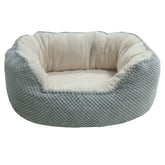 Side view of a Wave-Shaped pet bed showing the ergonomic contoured rim and textured bubble fabric.