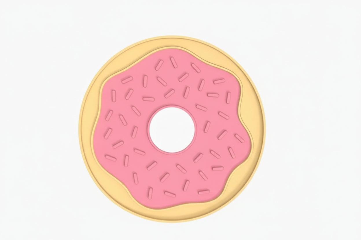 A donut-shaped product shown on a white background with dimension labels. The design features a pale yellow outer ring, a pink center with small pink sprinkle details, and a black outline.