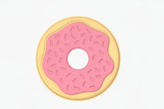 A donut-shaped product shown on a white background with dimension labels. The design features a pale yellow outer ring, a pink center with small pink sprinkle details, and a black outline.