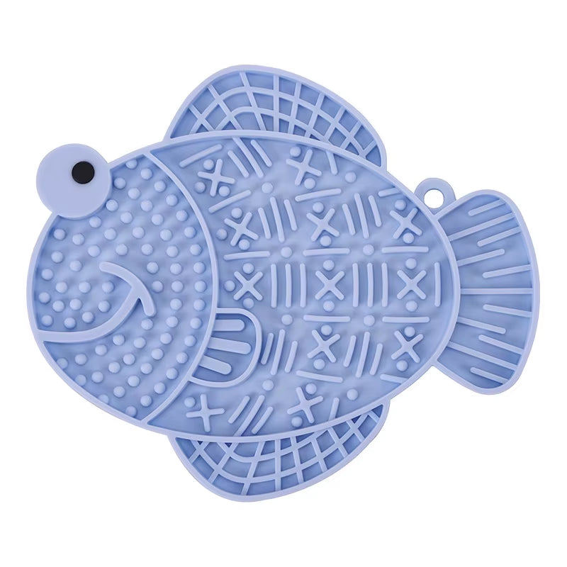 A blue fish-shaped anti-anxiety licking pad made of food-grade silicone for slow feeding.