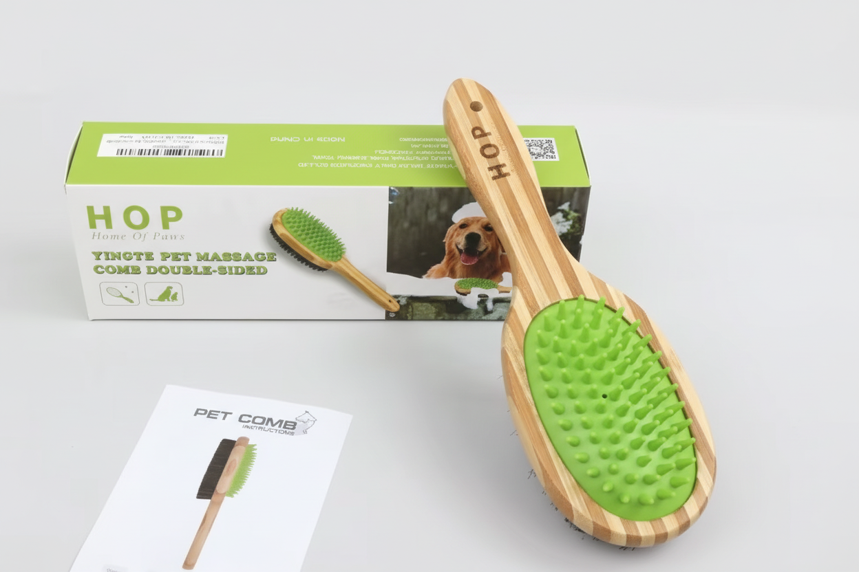 A bamboo double‑sided pet brush featuring soft green silicone bristles, displayed with product box, instruction card, and desiccant packet.