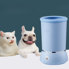 A blue electric pet paw cleaning cup with USB charging and soft silicone inner bristles, displayed next to a dog and a cat.