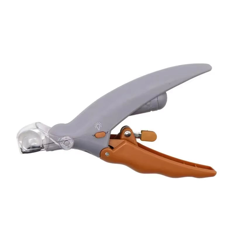 Close‑up image of LED pet nail clippers featuring a magnifying lens, ergonomic handle, and precision steel cutting blade.