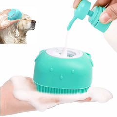 Hand pouring shampoo into a silicone pet bath brush with built‑in dispenser and foam output.