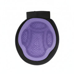 A purple dual‑sided pet grooming glove with textured rubber tips designed for bathing, massaging, and removing loose hair from cats and dogs.