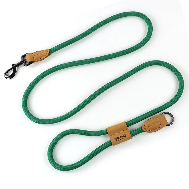 An outdoor ranger combat green hands-free dog traction lead showing its durable weather-resistant webbed strap design laying flat on a white surface.