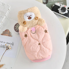An insulated blossom sakura pink quilted winter pet jacket featuring an adorable plush bear accent, embroidered stars, and a secure metal leash D-ring.