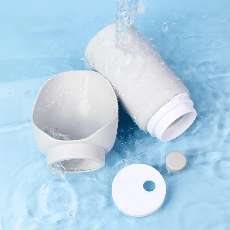 Demonstration of the Pawzation pet water bottle folding into a compact size for travel.