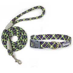 A high-contrast woven dog lead and collar set displaying a neon lime green, purple, and black patterned climbing rope leash paired with a heavy-duty side-release plastic snap buckle collar.