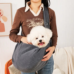 A charcoal slate dark grey premium pet travel pouch designed to comfortably distribute weight across the shoulders for hands-free transport.
