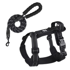 A Midnight Stealth Black reflective dog harness with a back control handle and breathable mesh interior.