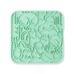 A green textured anti-choking silicone licking mat for dogs and cats with multiple suction cups for secure placement.