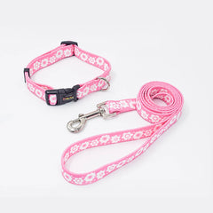 A charming bubblegum pink matching pet collar and walking leash set detailed with small white and pink flower prints.