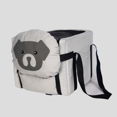 Beige foldable dog car seat with cute dog‑face front panel, black straps, and padded interior for safe pet travel.
