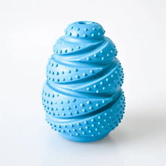 An interactive grenade-shaped arctic sky blue rubber dog food leaking educational toy displaying its texturized bumped bite-resistant ridges and hollow treat-dispensing interior core.