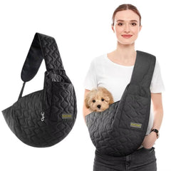 A classic black breathable cotton pet sling carrier showing the non-slip shoulder strap and the integrated essentials pocket for phones and keys.