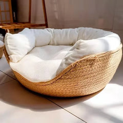Harvest Straw handwoven paper rope cat bed with a white plush cushion inside.