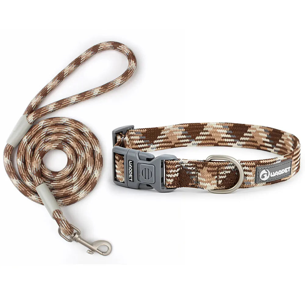 A rugged matching outdoor pet walking kit highlighting a rustic desert brown and khaki braided nylon rope traction lead with a coordinated adjustable metal D-ring collar.