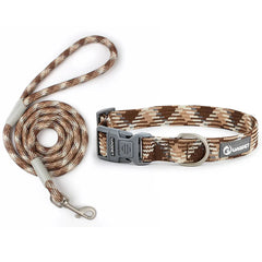 A rugged matching outdoor pet walking kit highlighting a rustic desert brown and khaki braided nylon rope traction lead with a coordinated adjustable metal D-ring collar.