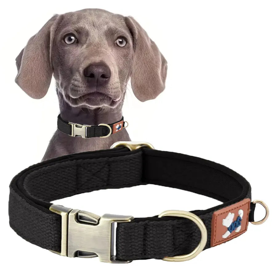 A sleek stealth tactical black heavy-duty dog collar laid flat to showcase the premium fine-weave fabric structure and high-load metal snap closure.