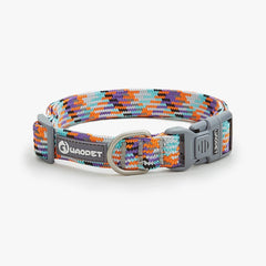 A bright Vibrant Neon Orange reflective safety collar for medium and large dogs showing a secure quick-release metal buckle and steel D-ring.