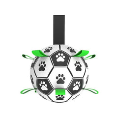 An interactive white dog soccer ball detailed with black paw-print graphics and 9 durable black nylon grab straps for fetching and tug games.