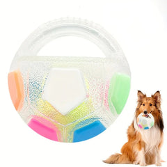 An interactive white rubber pet herding ball showing colorful multi-colored accent shapes and a molded non-slip exterior texture.