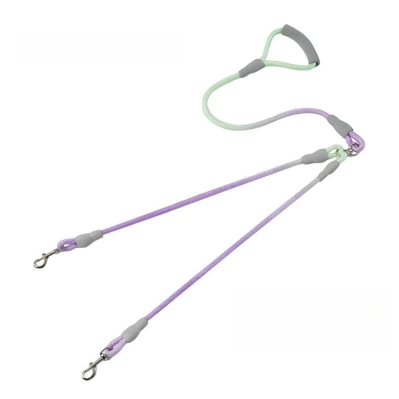 ewel-tone gradient dual dog leash with a padded gray handle and 360-degree tangle-free swivel clips for two dogs.