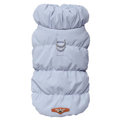 Light blue quilted winter dog vest with silver leash rings and designer patch.
