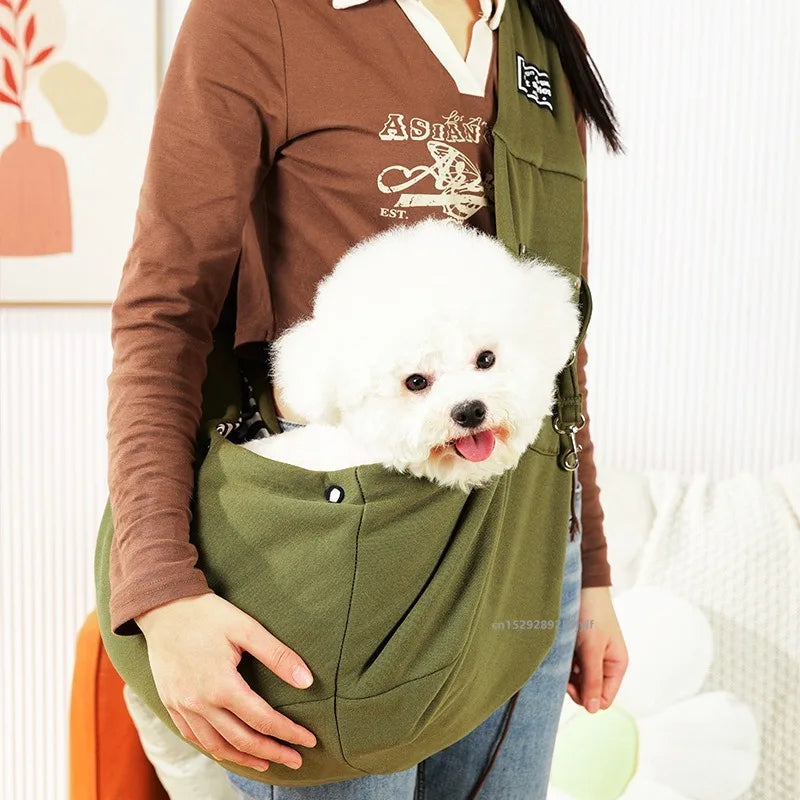 An outdoor ranger combat green single shoulder pet sling carrier displaying its rugged, casual style layout suitable for small breeds.