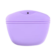 A portable purple silicone pet treat pouch with a magnetic closure and belt clip for outdoor training rewards.