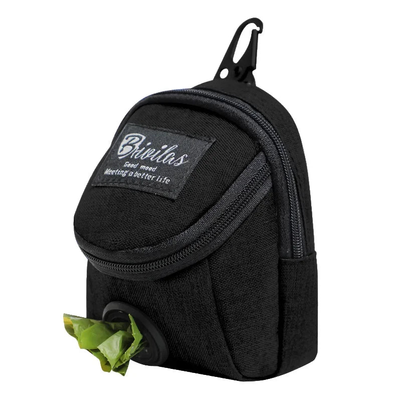 A slate grey portable dog training treat pouch with a waist strap and an integrated waste bag dispenser for outdoor pet rewards.