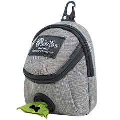 A slate grey portable dog training treat pouch with a waist strap and an integrated waste bag dispenser for outdoor pet rewards.