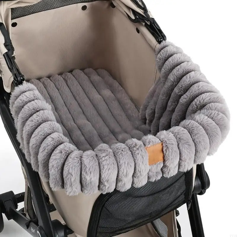 Beige pet stroller fitted with a plush, padded beige stroller cushion designed to provide comfort and warmth for pets during rides.