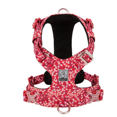 A vibrant Poppy Red dog vest harness featuring a classic white floral pattern with 3M reflective stitching and silver aluminum hardware.