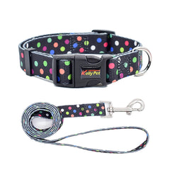 A sleek black adjustable collar and matching leash set covered in vibrant multi-colored neon confetti polka dots.
